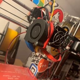 A custom-built cooling fan, mount, and nozzle system for a 3D printer. I built the original 3D Printer from a kit, and I designed this cooling system to improve the printer's capabilities and print-quality.