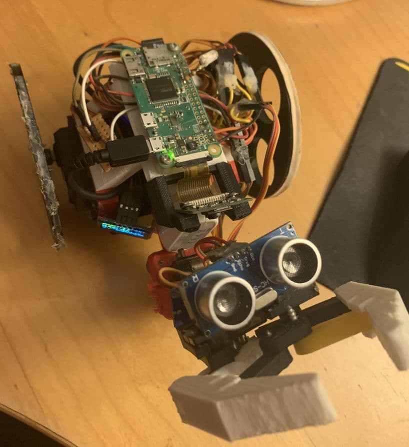 The robot's top view, showing the camera and ultrasonic sensor. The camera was used for object detection and the ultrasonic sensor was used to determine distance to objects.