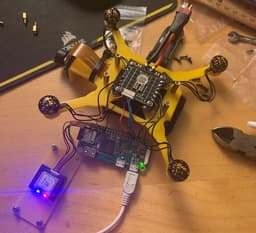 Parts of the quadcopter, including a Raspberry Pi, camera, GPS module, ESC management, and IMU. The drone was designed to be controlled via Bluetooth or WiFi, and I used a Raspberry Pi for the flight controller.
