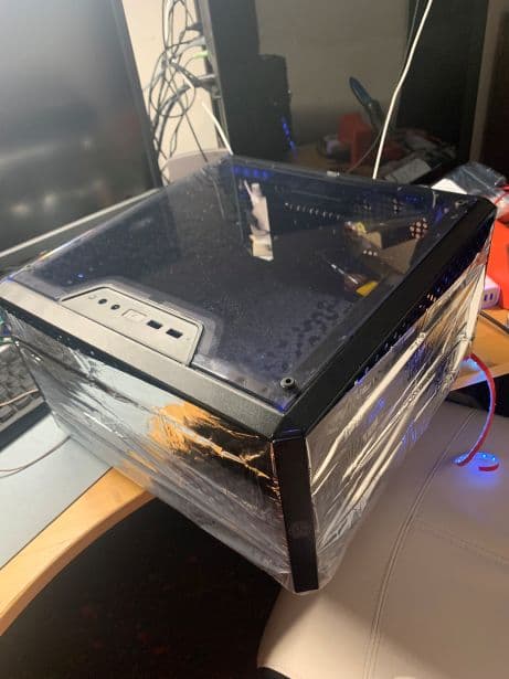 The setup of the mushroom environment, built with an old PC case, mylar insulation, and UV lights.