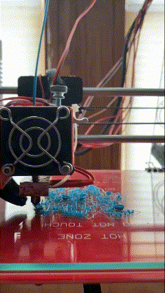 A 3D-printer stress test, showing the cooling system in action on a glass bed with intricate supports. This was a major improvement overall.